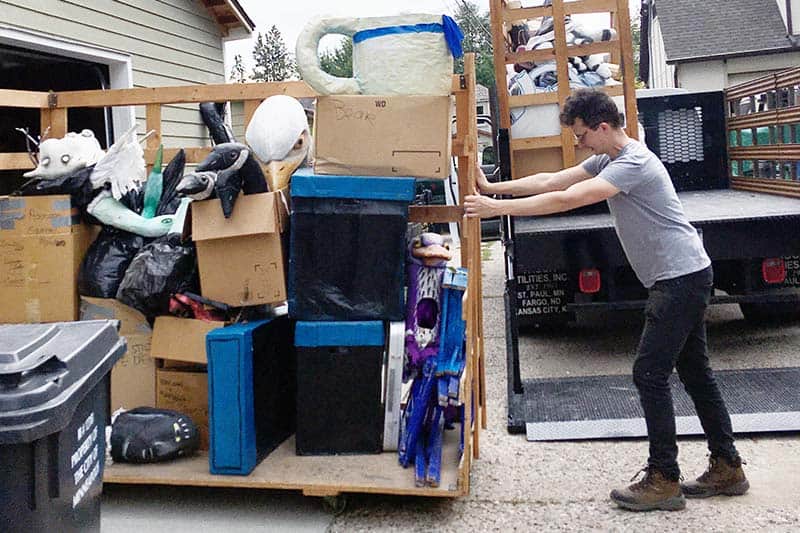 Steve Ackerman loading puppets into my neighbor's garage for temporary storage